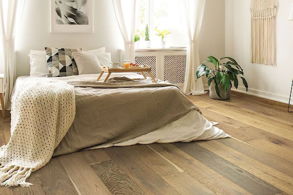 hardwood flooring in bedroom with black and white decor